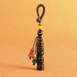 Pendentif bois ebene dragon porte-bonheur artisanal